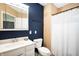 Neat bathroom features vanity with sink, a toilet, and shower with a white shower curtain at 11720 S County Road 396 E, Muncie, IN 47302