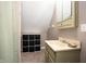 Compact bathroom features a sink, storage shelves, and shower with a shower curtain at 11720 S County Road 396 E, Muncie, IN 47302