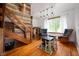 Inviting living room features wood accents, a cozy play area, and natural light from a large window at 11720 S County Road 396 E, Muncie, IN 47302