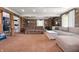 Basement living area featuring log walls, recessed lighting and comfortable seating at 11720 S County Road 396 E, Muncie, IN 47302