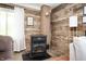 Charming living area featuring a wood burning stove and log walls at 11720 S County Road 396 E, Muncie, IN 47302