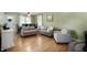 Bright living room with a fireplace, neutral sofas, and an adjacent dining area with a dark wood table at 11720 S County Road 396 E, Muncie, IN 47302