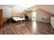 Spacious main bedroom boasts wood floors, ample natural light, and neutral wall color at 11720 S County Road 396 E, Muncie, IN 47302