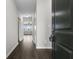 Inviting home foyer featuring wood floors and views through to the living room at 11815 Adair Pl, Indianapolis, IN 46229