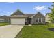 Charming one-story brick home with a well-manicured lawn, attached garage, and welcoming front entrance at 11815 Adair Pl, Indianapolis, IN 46229