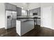Modern kitchen with stainless steel appliances and a center island with barstool seating at 11815 Adair Pl, Indianapolis, IN 46229
