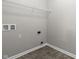 Simple laundry room with wire shelving, and vinyl flooring at 11815 Adair Pl, Indianapolis, IN 46229
