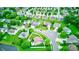 Aerial view of a residential neighborhood showcasing well-maintained homes, green trees, and quiet streets at 1199 Oak Leaf Rd, Franklin, IN 46131