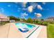 Refreshing backyard pool view, perfect for summer relaxation with a partially covered patio and green surroundings at 1199 Oak Leaf Rd, Franklin, IN 46131