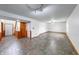 Spacious basement area with tile flooring, finished walls, and multiple access points at 1199 Oak Leaf Rd, Franklin, IN 46131