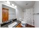 Bright bathroom with a granite countertop vanity and shower-tub combo at 1199 Oak Leaf Rd, Franklin, IN 46131