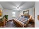 Staged bedroom featuring a large window, ceiling fan, and wood furniture at 1199 Oak Leaf Rd, Franklin, IN 46131