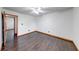 Empty bedroom features dark floors and a neutral color scheme at 1199 Oak Leaf Rd, Franklin, IN 46131
