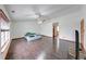 A spacious bedroom with vaulted ceilings, ceiling fan, and dark wood floors at 1199 Oak Leaf Rd, Franklin, IN 46131