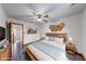 Bedroom with white walls, wood floors, ceiling fan, and natural decor at 1199 Oak Leaf Rd, Franklin, IN 46131