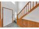 Bright foyer with a staircase featuring wood trim and banister, leading to the upper level at 1199 Oak Leaf Rd, Franklin, IN 46131