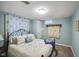 Inviting bedroom with decorative pillows, soft lighting, and a patterned blanket at 1240 Hamilton Dr, Noblesville, IN 46060