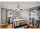 Charming bedroom showcasing a metal bed frame, wood floors, and modern decor at 1240 Hamilton Dr, Noblesville, IN 46060