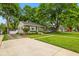 Well-maintained home with manicured lawn and driveway leading to garage at 1240 Hamilton Dr, Noblesville, IN 46060
