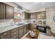Updated kitchen with stainless steel appliances, ample counter space, and updated cabinets at 1240 Hamilton Dr, Noblesville, IN 46060