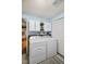 Convenient laundry room with modern appliances, ample storage, and shelving at 1240 Hamilton Dr, Noblesville, IN 46060