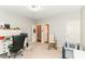 A versatile bedroom with carpet, a large desk, and ample closet space offers a flexible area for work or rest at 12994 Dekoven Dr, Fishers, IN 46037