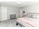 Comfortable bedroom with gray walls, a cozy bed, and a dresser for ample storage space at 12994 Dekoven Dr, Fishers, IN 46037