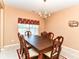 Elegant dining room with a classic chandelier and ample seating for Gathering gatherings at 12994 Dekoven Dr, Fishers, IN 46037