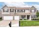 Beautiful two-story home boasts a well-kept lawn and classic architectural details at 12994 Dekoven Dr, Fishers, IN 46037