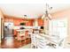 Bright kitchen featuring stainless steel appliances, wood cabinets, and an eat-in dining area at 12994 Dekoven Dr, Fishers, IN 46037