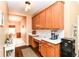 A kitchen nook features ample cabinet space, white countertops, and hardwood floors at 12994 Dekoven Dr, Fishers, IN 46037