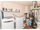 Bright laundry room with washer, dryer, shelving, and essential utility fixtures and equipment at 12994 Dekoven Dr, Fishers, IN 46037