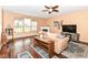 A cozy living room features hardwood floors, a fireplace, and large windows, creating a warm and inviting atmosphere at 12994 Dekoven Dr, Fishers, IN 46037
