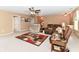 Spacious living room features neutral walls, carpeting, and multiple seating areas at 12994 Dekoven Dr, Fishers, IN 46037