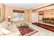 Comfortable living room featuring a bright window and seamless access to the dining area at 12994 Dekoven Dr, Fishers, IN 46037