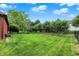 A sprawling, well-maintained backyard with lush green grass and mature trees, perfect for outdoor activities and relaxation at 14492 Allison Dr, Carmel, IN 46033