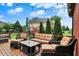 Charming patio featuring cozy seating arrangements, a dining area, and string lights at 14492 Allison Dr, Carmel, IN 46033