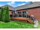 Inviting outdoor patio, steps down to green backyard, ideal for entertainment and relaxation at 14492 Allison Dr, Carmel, IN 46033