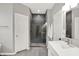 A stylish bathroom showcases a glass shower, door, and a crisp white vanity with modern fixtures at 14492 Allison Dr, Carmel, IN 46033