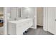 Bright bathroom featuring a double sink vanity, modern fixtures, and sleek gray tile flooring at 14492 Allison Dr, Carmel, IN 46033