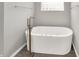 This bright bathroom features a freestanding tub with modern fixtures and a relaxing ambiance at 14492 Allison Dr, Carmel, IN 46033