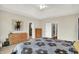 Bright bedroom with neutral carpet, ceiling fan, and modern decor at 14492 Allison Dr, Carmel, IN 46033