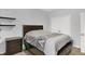 Comfortable bedroom featuring a bed, nightstand, and double door closet at 14492 Allison Dr, Carmel, IN 46033