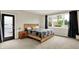 Bright bedroom with neutral carpet, a large window, and modern decor at 14492 Allison Dr, Carmel, IN 46033
