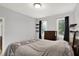 Bright bedroom with carpet, dresser, black out curtains, and floating shelves at 14492 Allison Dr, Carmel, IN 46033