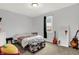 Cozy bedroom featuring a comfortable bed, a stylish bench, and guitars for a musical touch at 14492 Allison Dr, Carmel, IN 46033