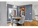 Elegant dining area featuring stylish lighting fixtures and a built-in bar for sophisticated dining at 14492 Allison Dr, Carmel, IN 46033