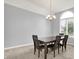 Bright dining room featuring large windows, a chandelier, and seating for six, making it ideal for entertaining guests at 14492 Allison Dr, Carmel, IN 46033