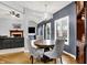 Inviting dining room with modern chandelier and large windows providing ample natural light and views at 14492 Allison Dr, Carmel, IN 46033