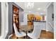 Charming dining area with stylish bar showcasing seamless access to the kitchen at 14492 Allison Dr, Carmel, IN 46033